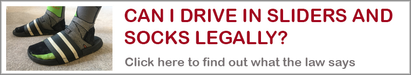 Banner asking can wear sliders while driving